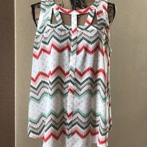 A sleeveless flowy blouse